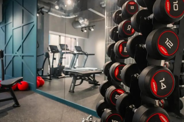 Dumbbells treadmills and workout bench gym at Redgate in Nottingham Student Accommodation