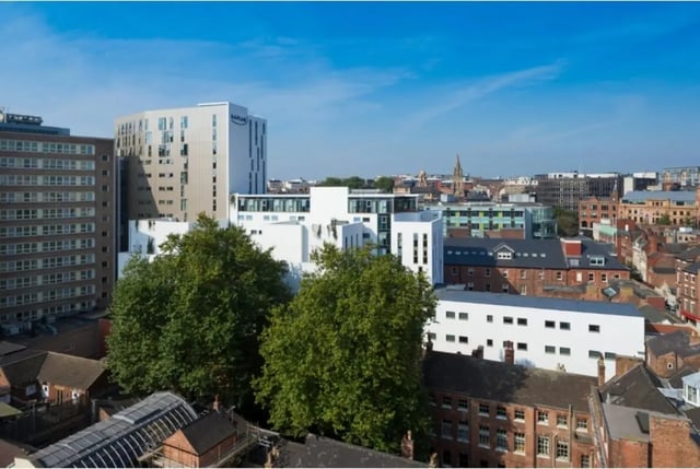 Modern buildings among trees exterior view at Kaplan Living Nottingham in Nottingham Student Accommodation