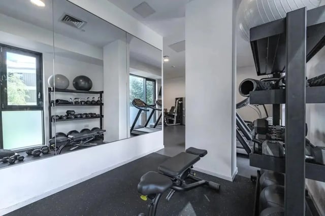 Dumbbell rack, weights, bench, treadmills, gym. at Wembley Barnard Point in London Student Accommodation