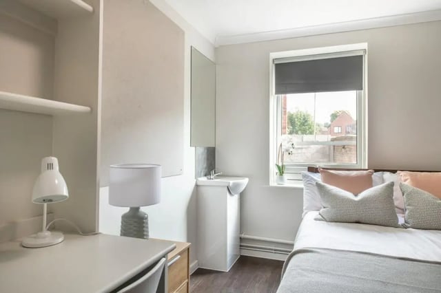 Desk lamp sink bed pillows bedroom at 4 Rob Roy House in Nottingham Student Accommodation