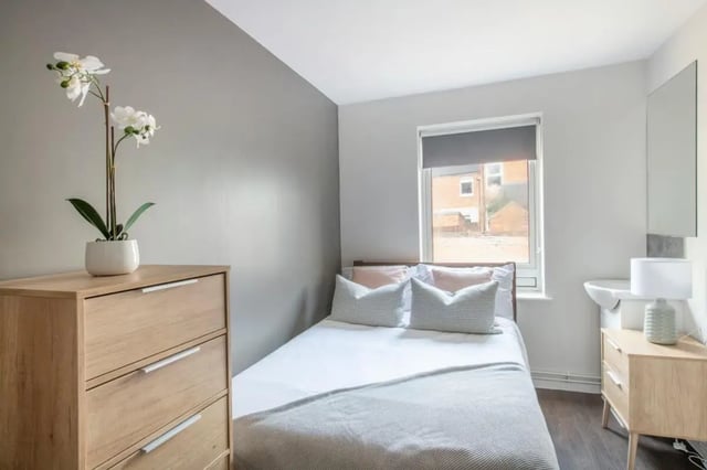 Chest of drawers orchid bed sink lamp Bedroom at 4 Rob Roy House in Nottingham Student Accommodation
