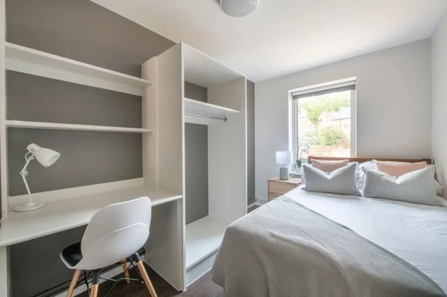 Bed desk and wardrobe with white chair bedroom at 4 Rob Roy House in Nottingham Student Accommodation