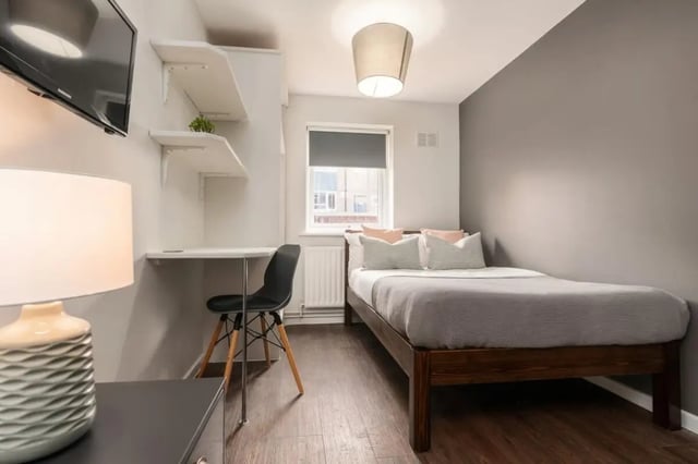 Bed desk shelves television lamp bedroom at 28 Church Street in Nottingham Student Accommodation