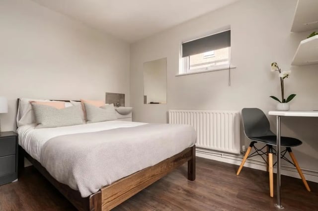 Bed sink desk chair and orchid bedroom at 28 Church Street in Nottingham Student Accommodation