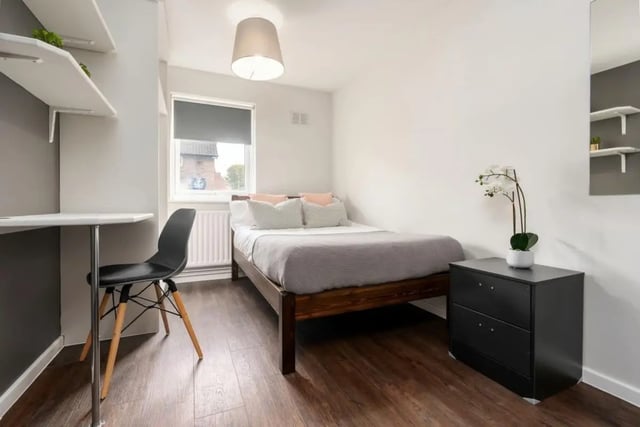 Bed desk chair nightstand and shelves bedroom at 28 Church Street in Nottingham Student Accommodation
