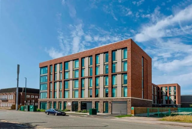Brick building with multiple floors and windows exterior at Triumph House in Nottingham Student Accommodation