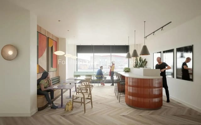 Bar area with seating and large window common area at Wilson House in Oxford Student Accommodation