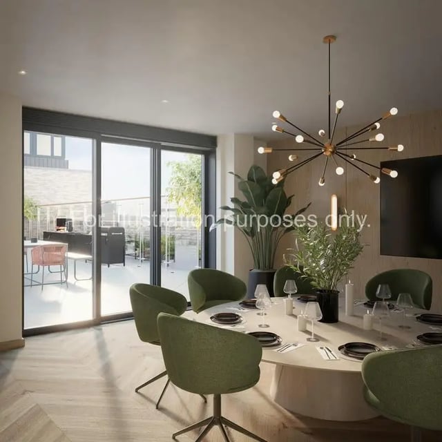 Dining table with green chairs and plants living room at Wilson House in Oxford Student Accommodation