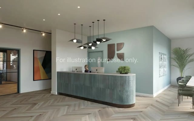 Reception desk with computers and plant reception area at Wilson House in Oxford Student Accommodation
