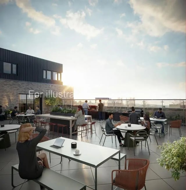 People dining and grilling on a rooftop patio exterior at Wilson House in Oxford Student Accommodation