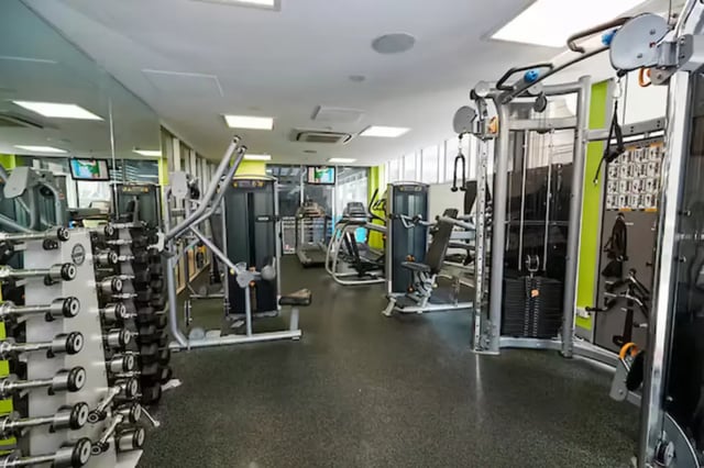 Dumbbells treadmills weight machines gym facility at Scape Adelaide Central in Adelaide Student Accommodation