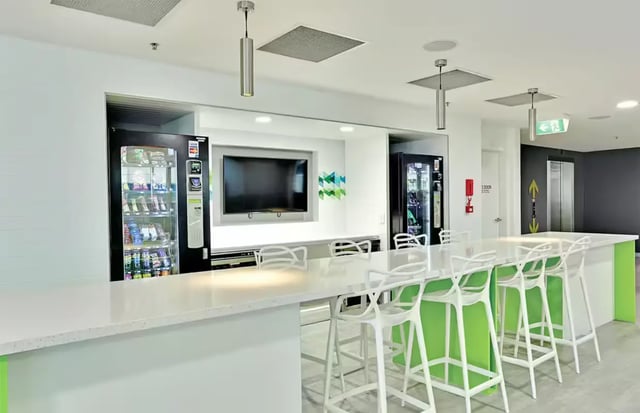 Vending machines TV bar with stools communal area at Scape Adelaide Central in Adelaide Student Accommodation