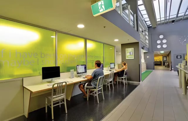 Computers and students at desks study area at Scape Adelaide Central in Adelaide Student Accommodation
