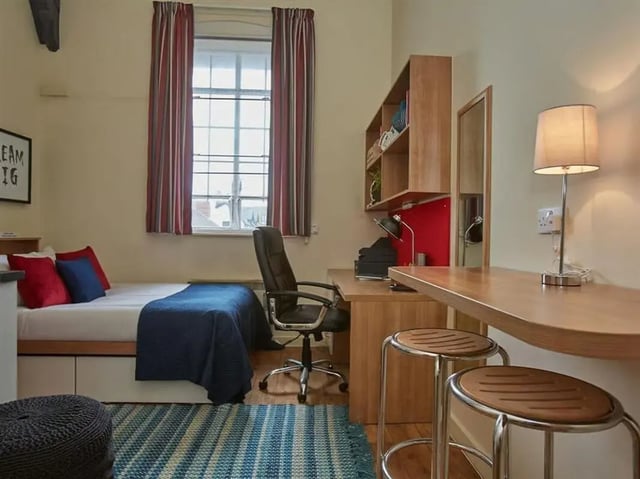 Bed desk chair shelves lamp stools bedroom at Abbeygate in Chester Student Accommodation