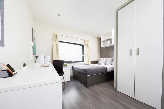 Bed desk chair wardrobe bedroom at Grand Central in Liverpool Student Accommodation