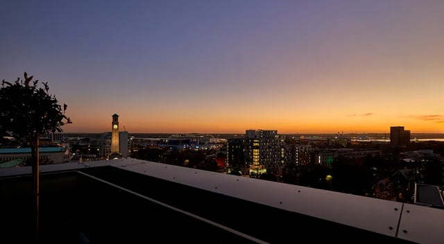 Rooftop view of city buildings and clock tower exterior at Cumberland Place in Southampton Student Accommodation