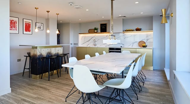 Modern kitchen with marble table and bar area communal space at Cumberland Place in Southampton Student Accommodation