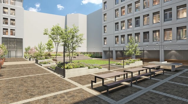 Courtyard with tables benches and ping pong table exterior at Telephone House in Dundee Student Accommodation