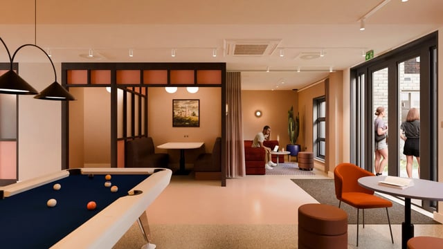 Pool table booths seating and people communal area at Valerian in York Student Accommodation