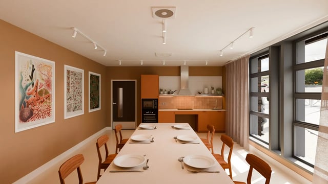 Dining table with chairs and kitchen area common room at Valerian in York Student Accommodation