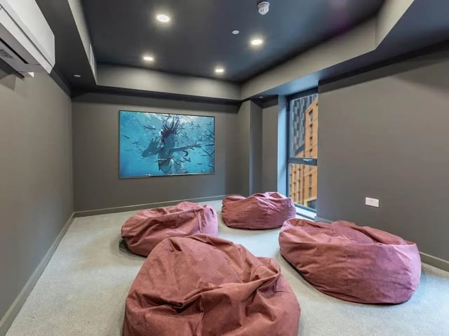 Beanbag chairs and movie screen living room at Straits Aire in Leeds Student Accommodation