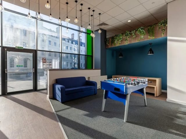 Blue sofa foosball table communal room at Saltwater Place in Plymouth Student Accommodation