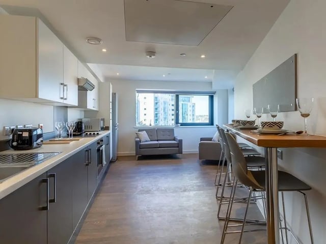 Kitchen with seating area and sofa living room at Saltwater Place in Plymouth Student Accommodation
