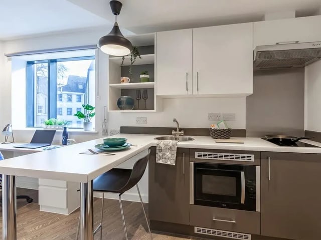 Kitchenette with desk and laptop kitchen area at Saltwater Place in Plymouth Student Accommodation