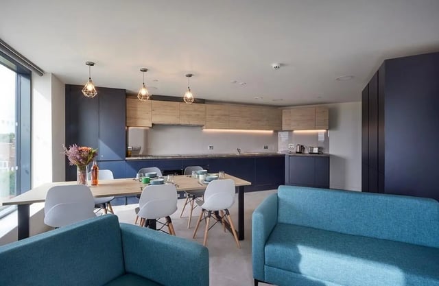 Kitchen with table sofas and modern cabinets kitchen at Regatta Place in Durham Student Accommodation