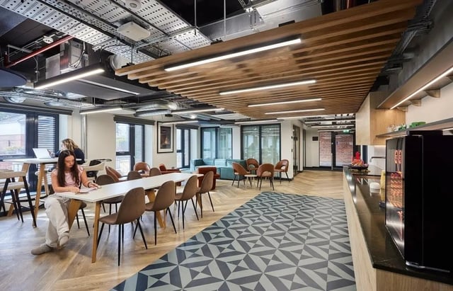 Dining area with chairs study tables coffee machine communal area at Regatta Place in Durham Student Accommodation