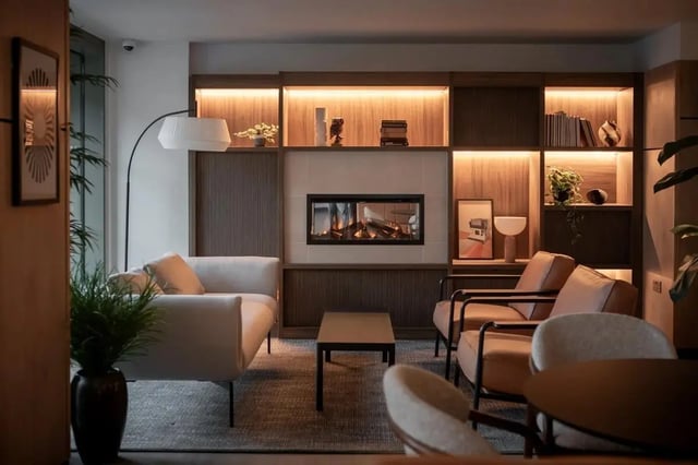 Modern lounge with fireplace and seating living room at Centre Court in Nottingham Student Accommodation