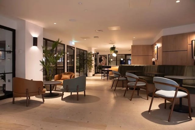 Modern seating area with tables and chairs living room at Centre Court in Nottingham Student Accommodation