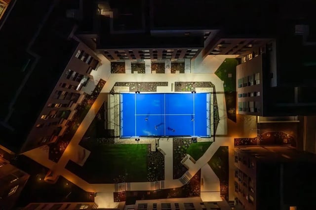 Aerial view of illuminated court with people playing playing area exterior at Centre Court in Nottingham Student Accommodation
