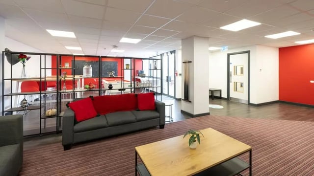 Sofa pool table red shelves lounge living area at Marland House in Southampton Student Accommodation