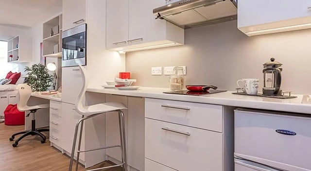 Microwave desk chair and kitchenette kitchen at Marland House in Southampton Student Accommodation