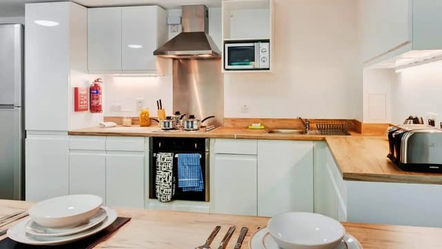 Microwave pots fire extinguisher toaster kitchen area at The Old Dairy in Plymouth Student Accommodation