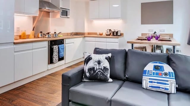 Kitchen sofa and dining area living room at The Old Dairy in Plymouth Student Accommodation