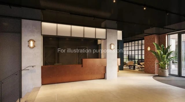 Reception desk plant and seating area lobby at Ark Canning Town in London Student Accommodation