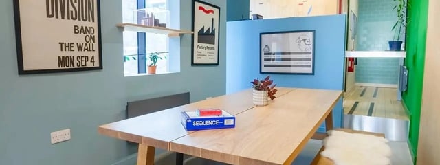 Dining table with games and plants communal area at Element Manchester in Manchester Student Accommodation