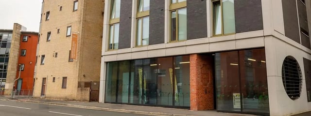 Modern building windows glass entrance exterior at Element Manchester in Manchester Student Accommodation