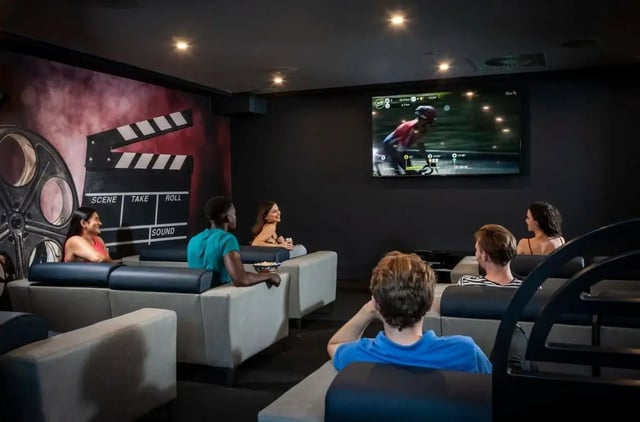 Students watch movie screen with clapperboard wall Cinema room at Study Inn Talbot Street Nottingham in Nottingham Student Accommodation