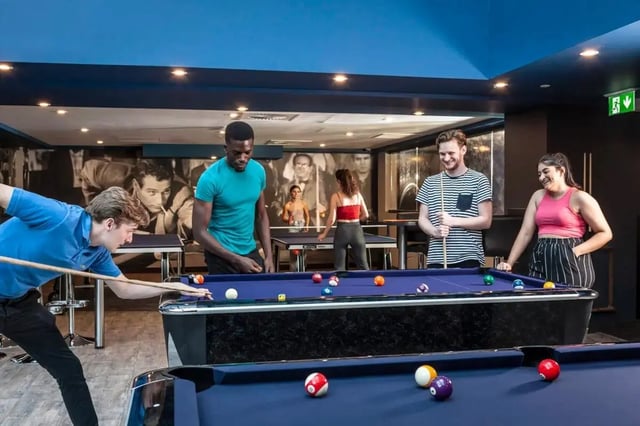 Students playing billiards at pool tables common room at Study Inn Talbot Street Nottingham in Nottingham Student Accommodation