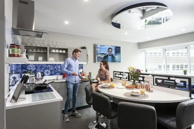 Students cooking and eating at breakfast bar kitchen at Study Inn Talbot Street Nottingham in Nottingham Student Accommodation