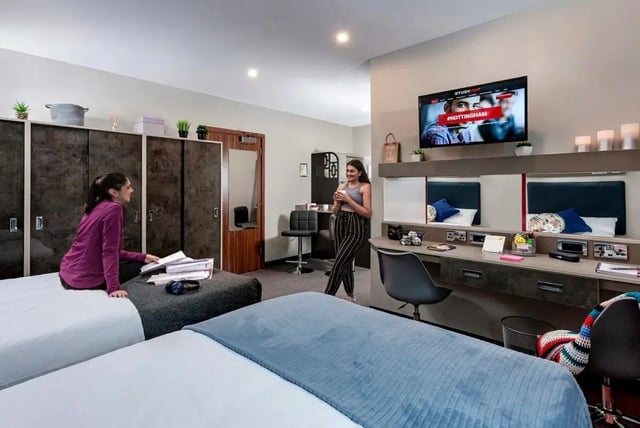 Two beds bedside cabinets and desks bedroom at Study Inn Talbot Street Nottingham in Nottingham Student Accommodation