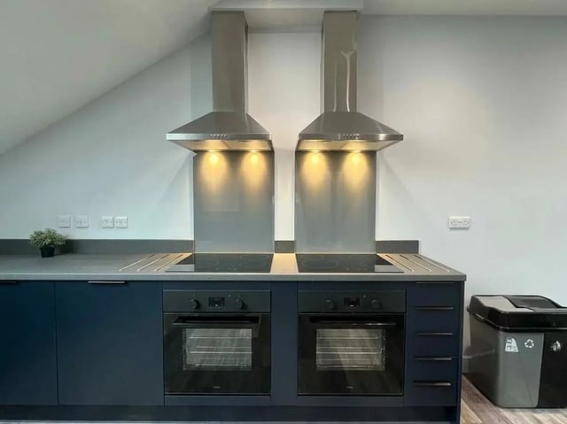 Two ovens two stoves with hoods kitchen at Commercial Point Nottingham in Nottingham Student Accommodation