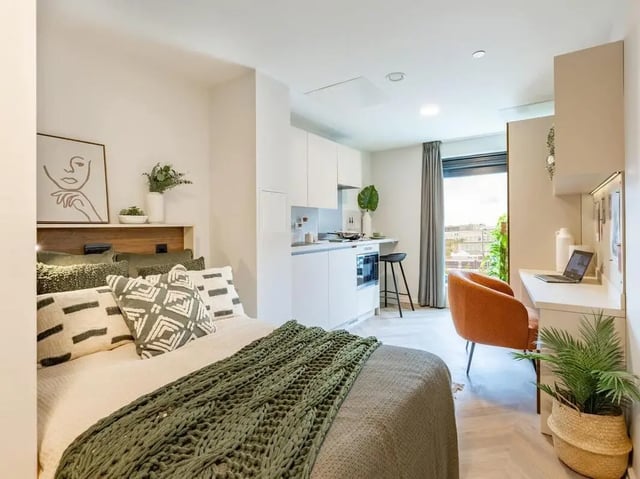 Bed with modern kitchen and desk area Studio at The Place in Nottingham Student Accommodation