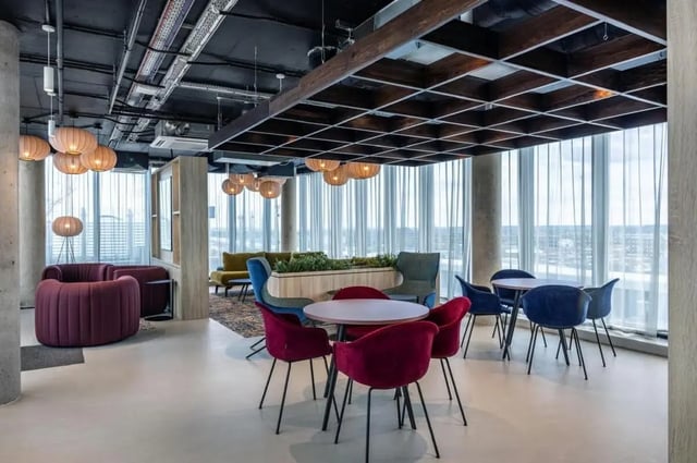 Velvet chairs tables with large windows lounge at The Place in Nottingham Student Accommodation