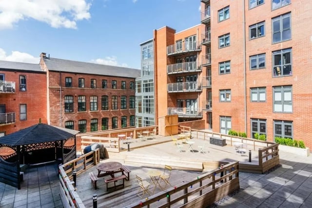 Wooden decking with tables benches gazebo exterior at Cornerhouse in Sheffield Student Accommodation