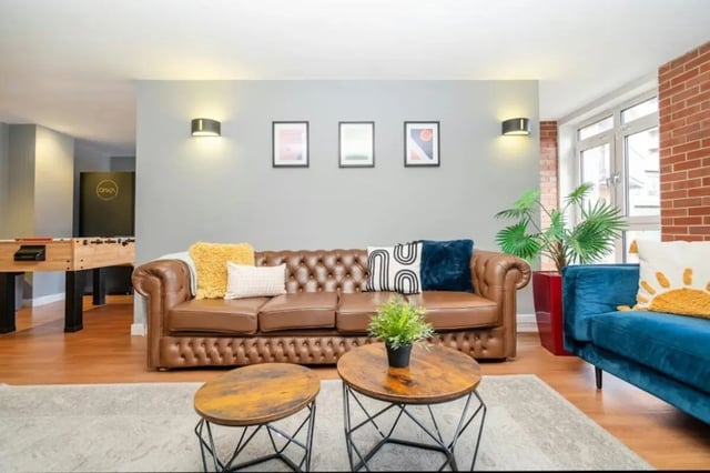 Chesterfield sofa blue sofa foosball table living room at Cornerhouse in Sheffield Student Accommodation