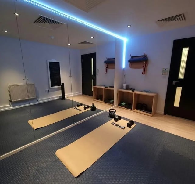 Gym mats kettlebells weights and shelves gym at Laycock Studios in Sheffield Student Accommodation